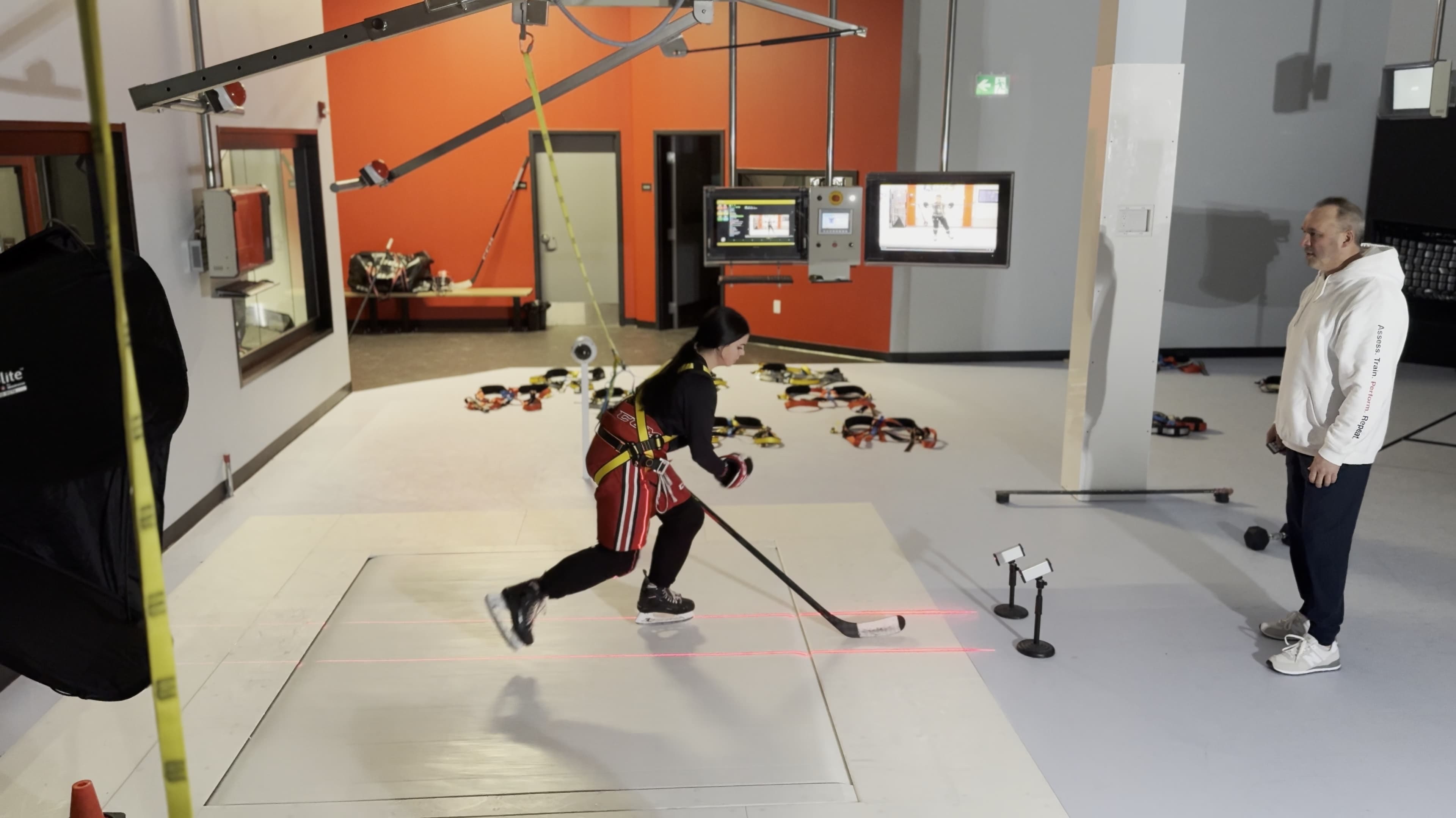 Coaches running video review session with young hockey players