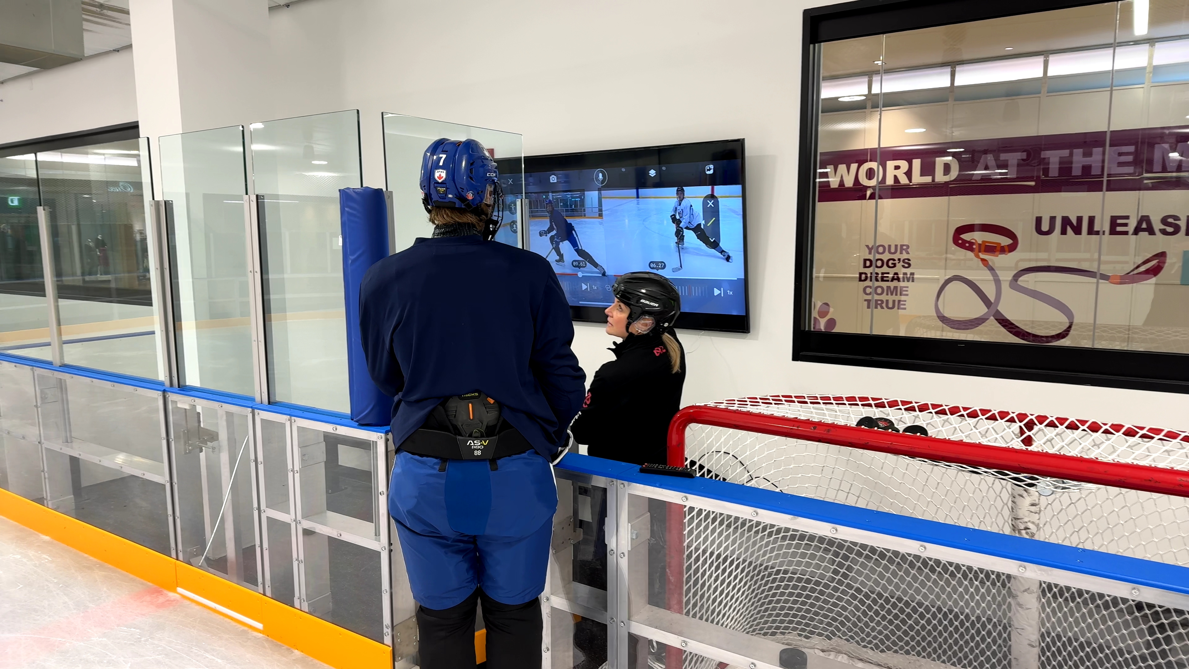 Hockeyology coach reviewing player data
