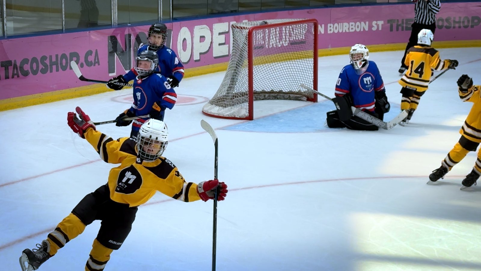 Players competing during a Summer Puck Drop Cup game